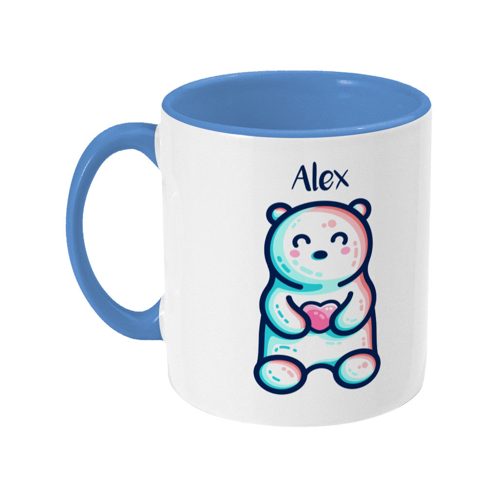 A blue two toned ceramic mug with the name Alex and a polar bear design beneath - back view