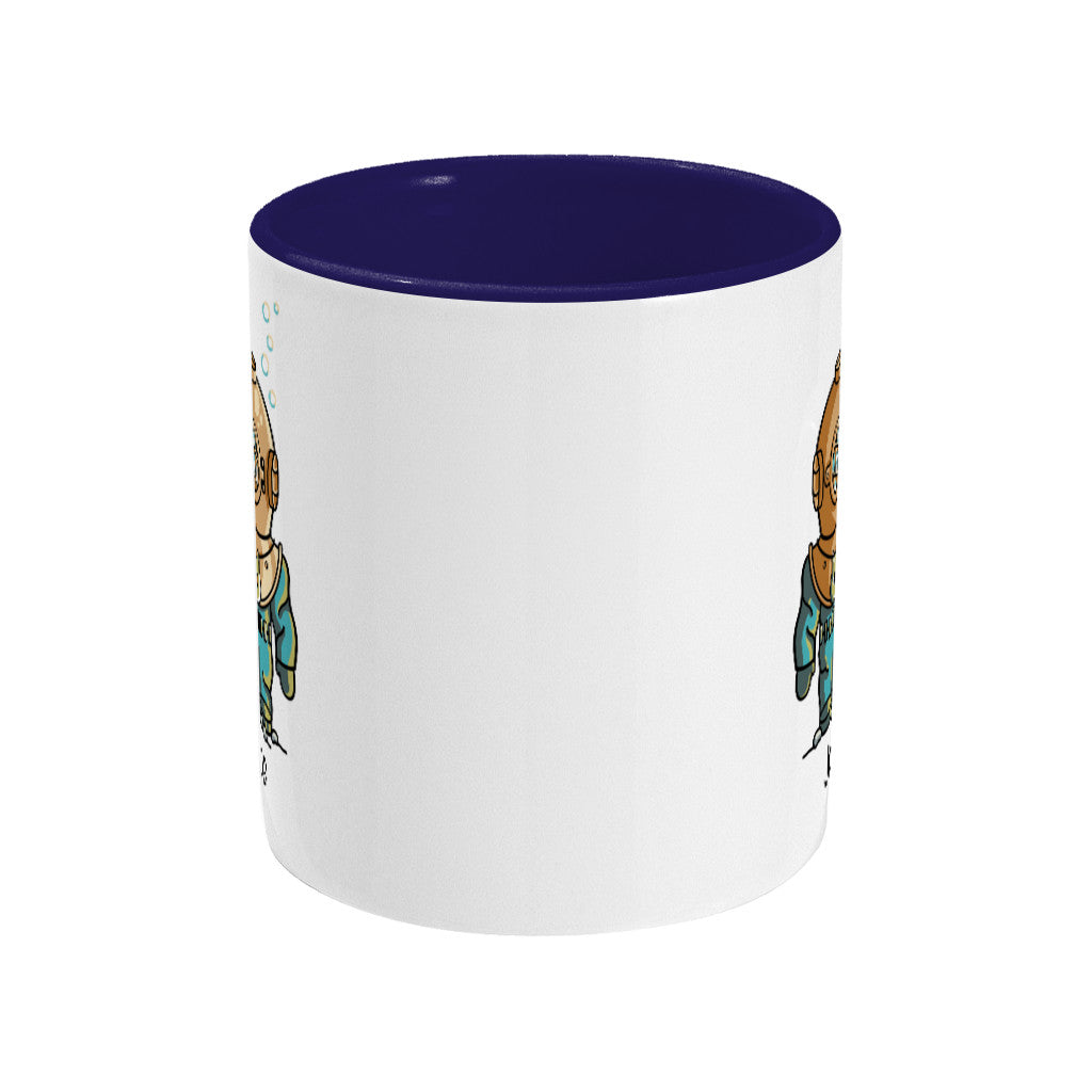 A two toned navy and white ceramic mug, showing a side view with the handle hidden behind, with the edge of a design showing to the left and right sides of the mug.
