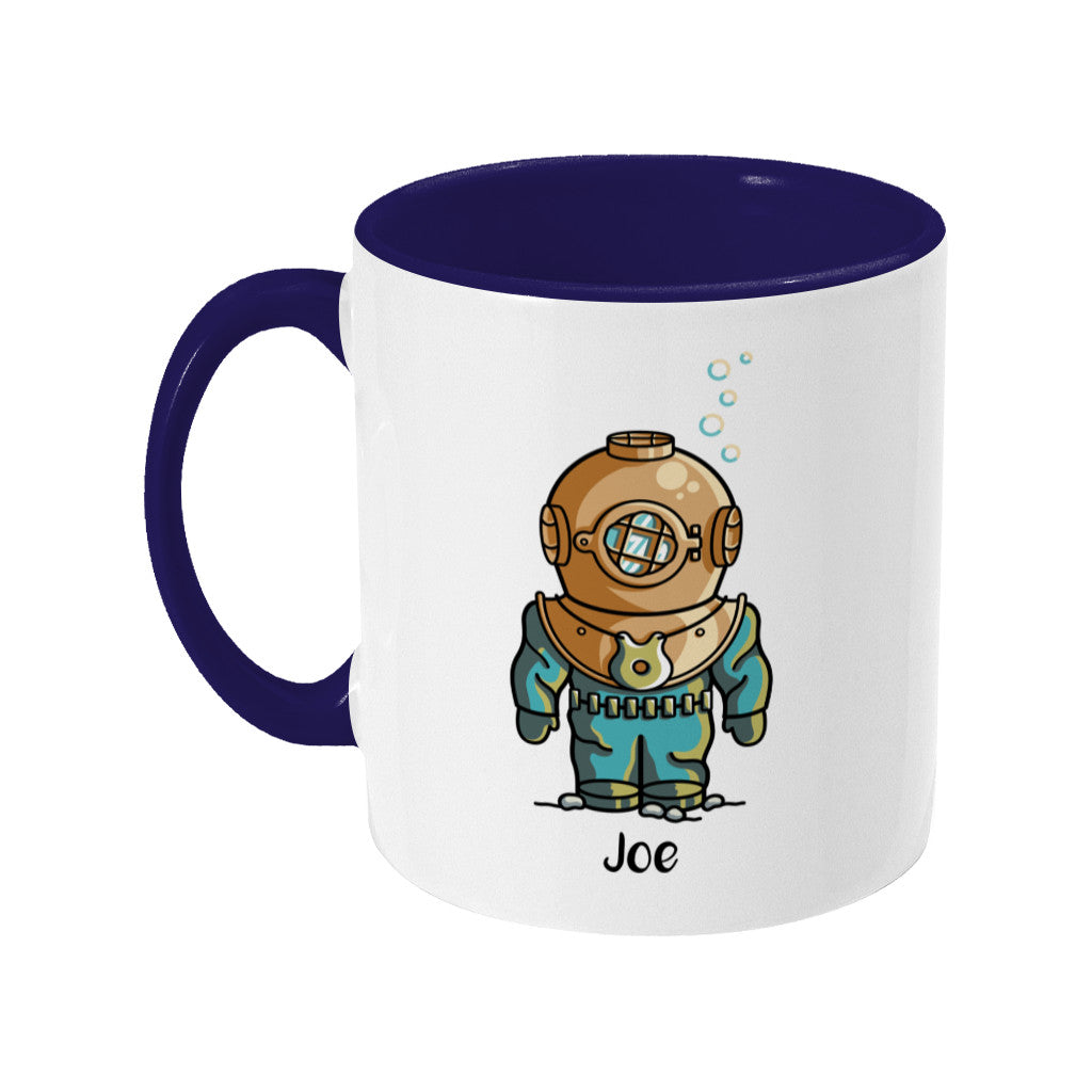 A two toned navy and white ceramic mug, handle to the left, with a personalised design of a cute vintage deep sea diver.