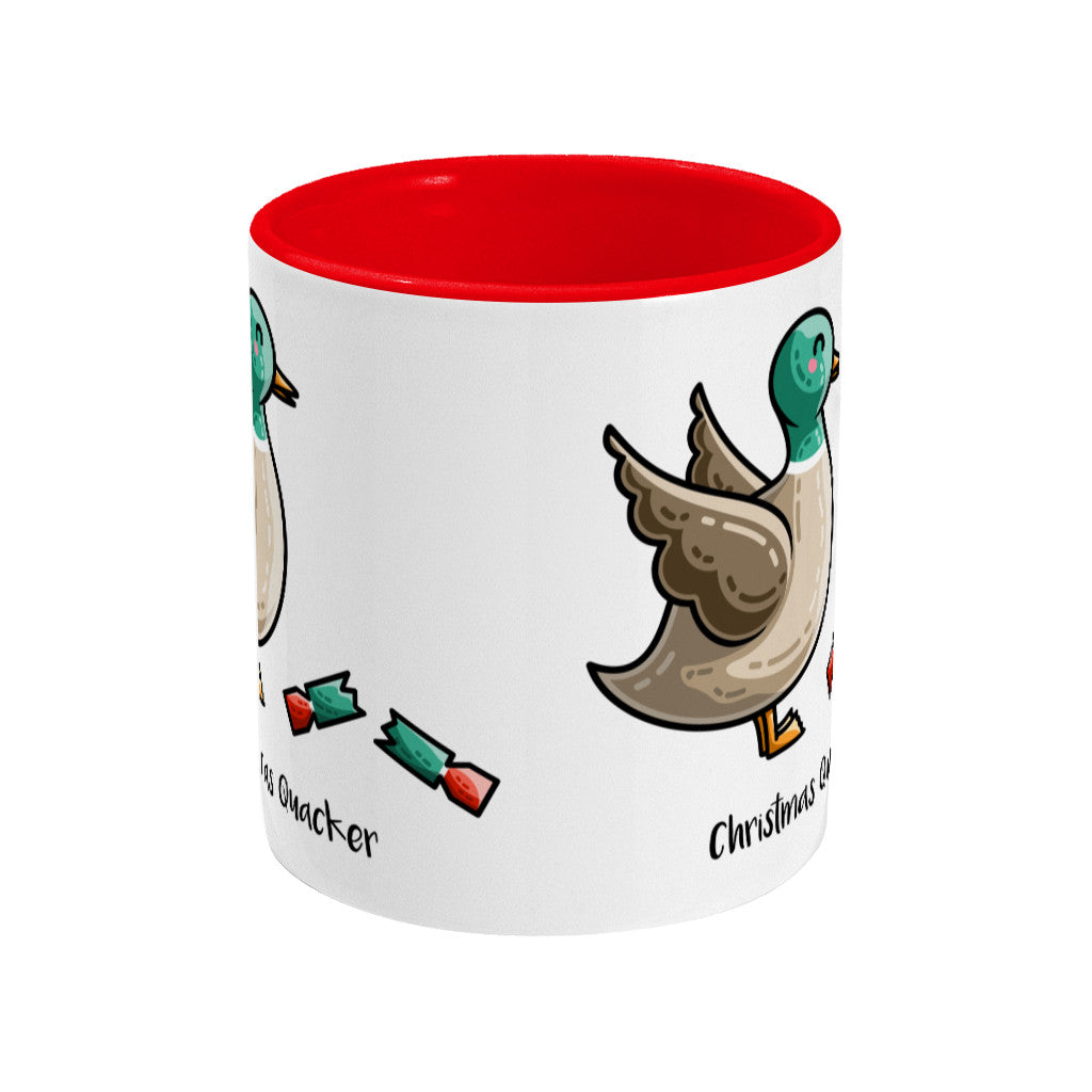 A two toned white and red ceramic mug seen side on with the handle hidden behind and a portion of the design visible at each edge of the mug