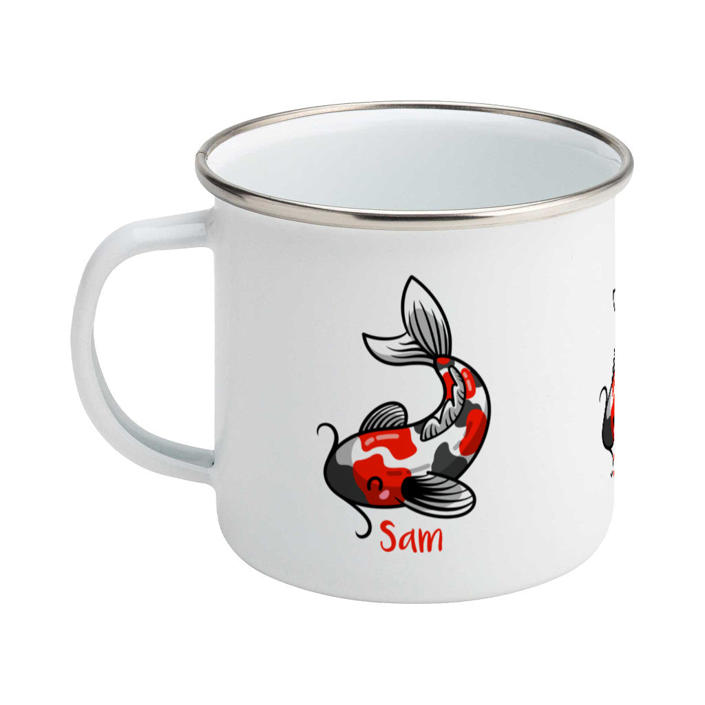 Kawaii cute orange, white and black koi carp fish design on a silver rimmed white enamel mug, showing LHS
