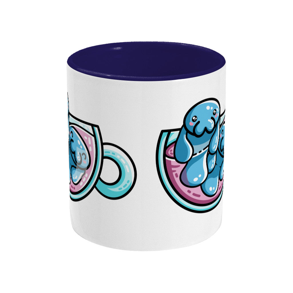 Two cute blue manatees swimming in a glass teacup design on a two toned blue and white ceramic mug, middle view