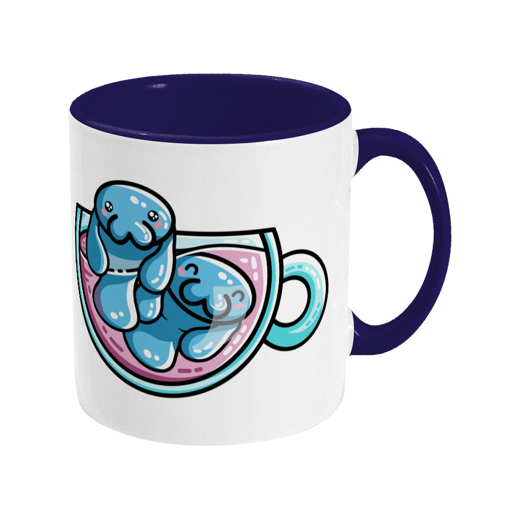 Two cute blue manatees swimming in a glass teacup design on a two toned blue and white ceramic mug, showing RHS