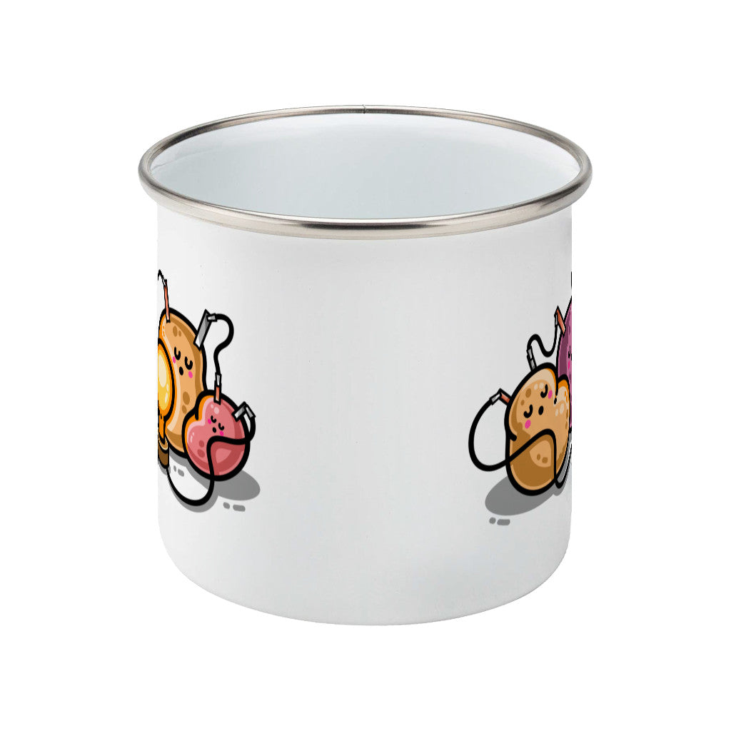 A silver rimmed white enamel mug seen from the side with the handle behind and a bit of the design visible at each side.