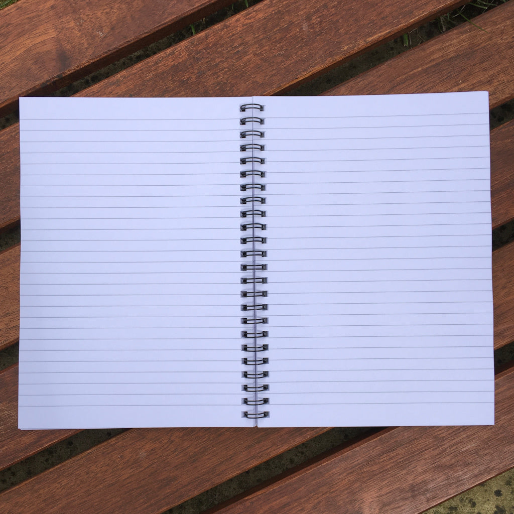 Open notebook showing the inside lined pages