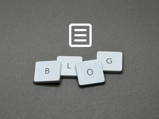 Four letter tyles spelling out the word blog, with an icon of a paper list above it, against a grey background
