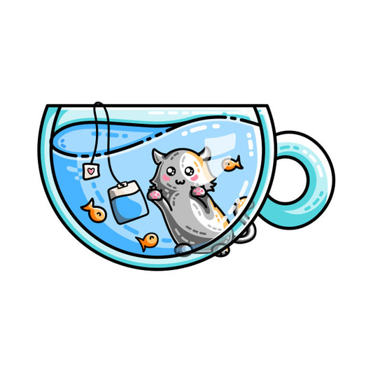 Cute kitten watching fish in a teacup