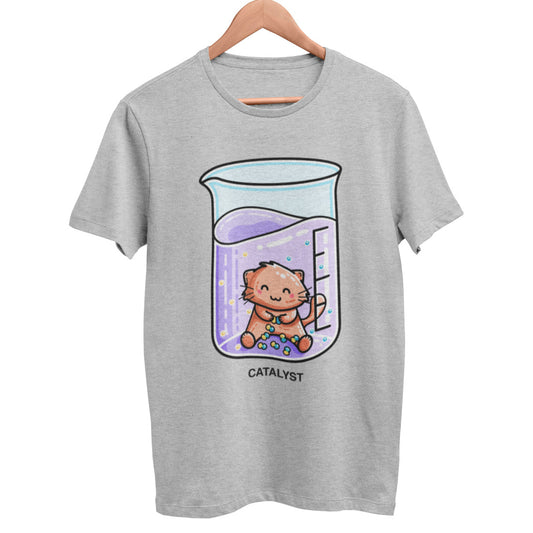 A heather grey unisex crewneck t-shirt on a hanger with a design on its chest of a cute ginger cat sitting in a chemistry beaker of purple liquid joining atoms or yellow and green together