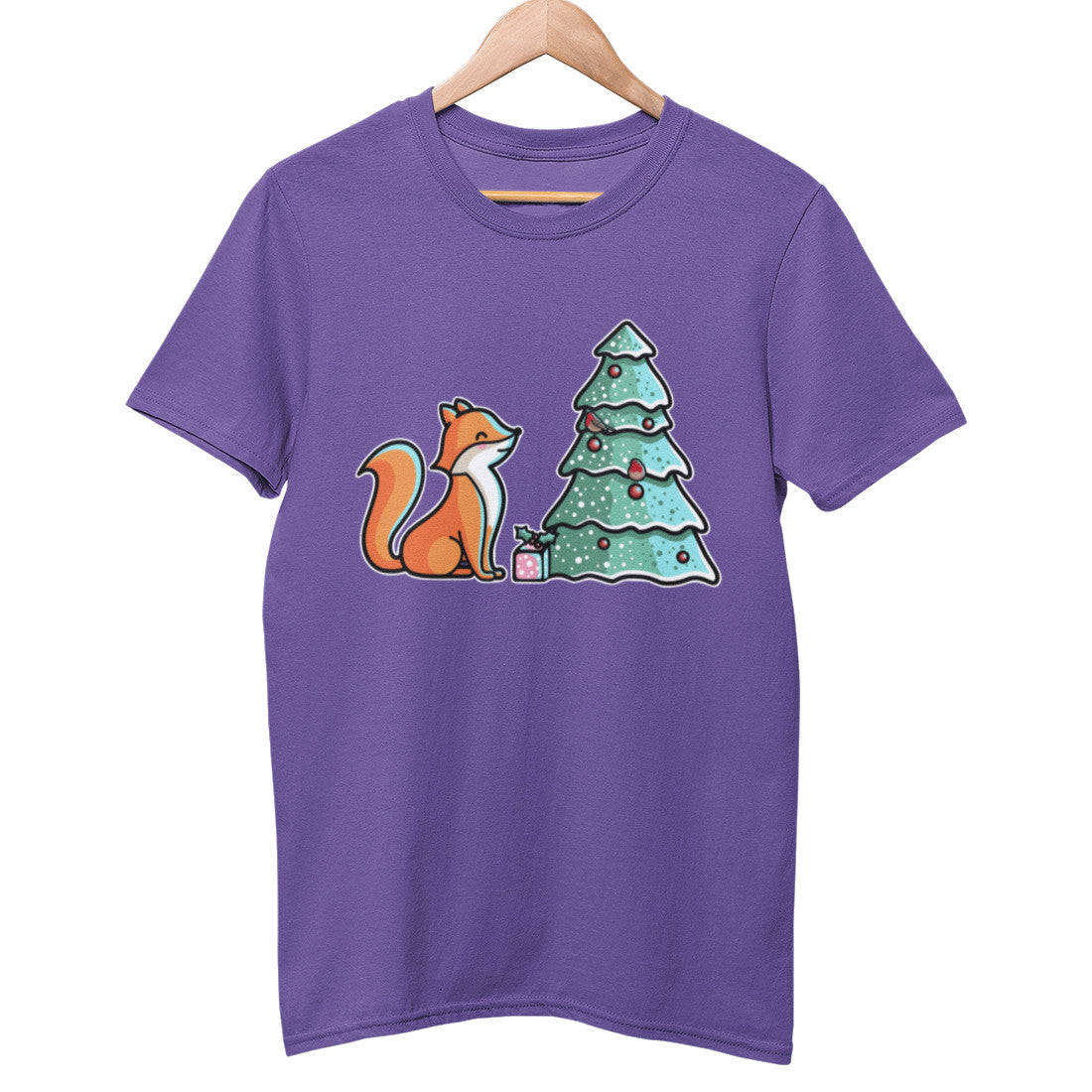 A royal blue colour unisex crewneck t-shirt on a wooden hanger with a design on its chest of a cute orange fox with a wrapped present, looking up at a Christmas tree