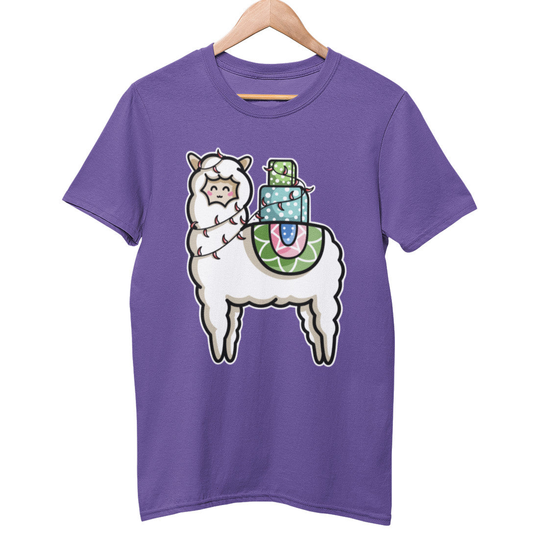 A purple unisex crewneck t-shirt on a wooden hanger with a design on its chest of a white llama with a stack of presents on its back and a string of chilli lights