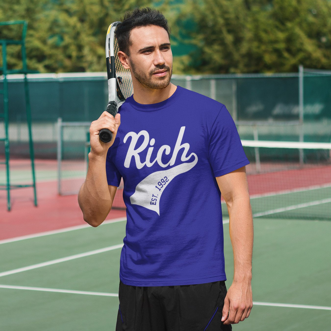 Man playing tennis wearing personalised name and year athletic swish blue crewneck t-shirt
