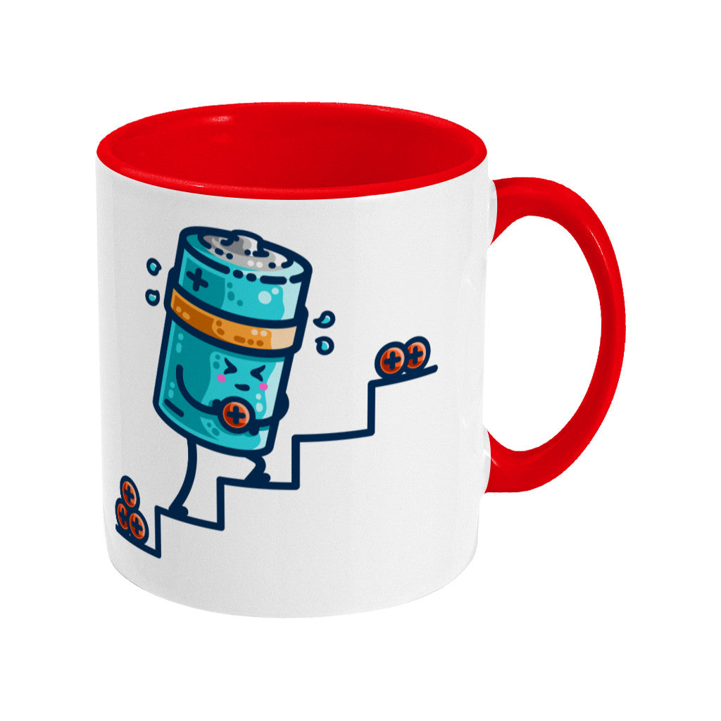A two-toned red and white ceramic mug with the handle to the right and a design of a kawaii cute blue cylindrical battery wearing an orange sweatband, with a facial expression of effort, moving positive charge up steps.