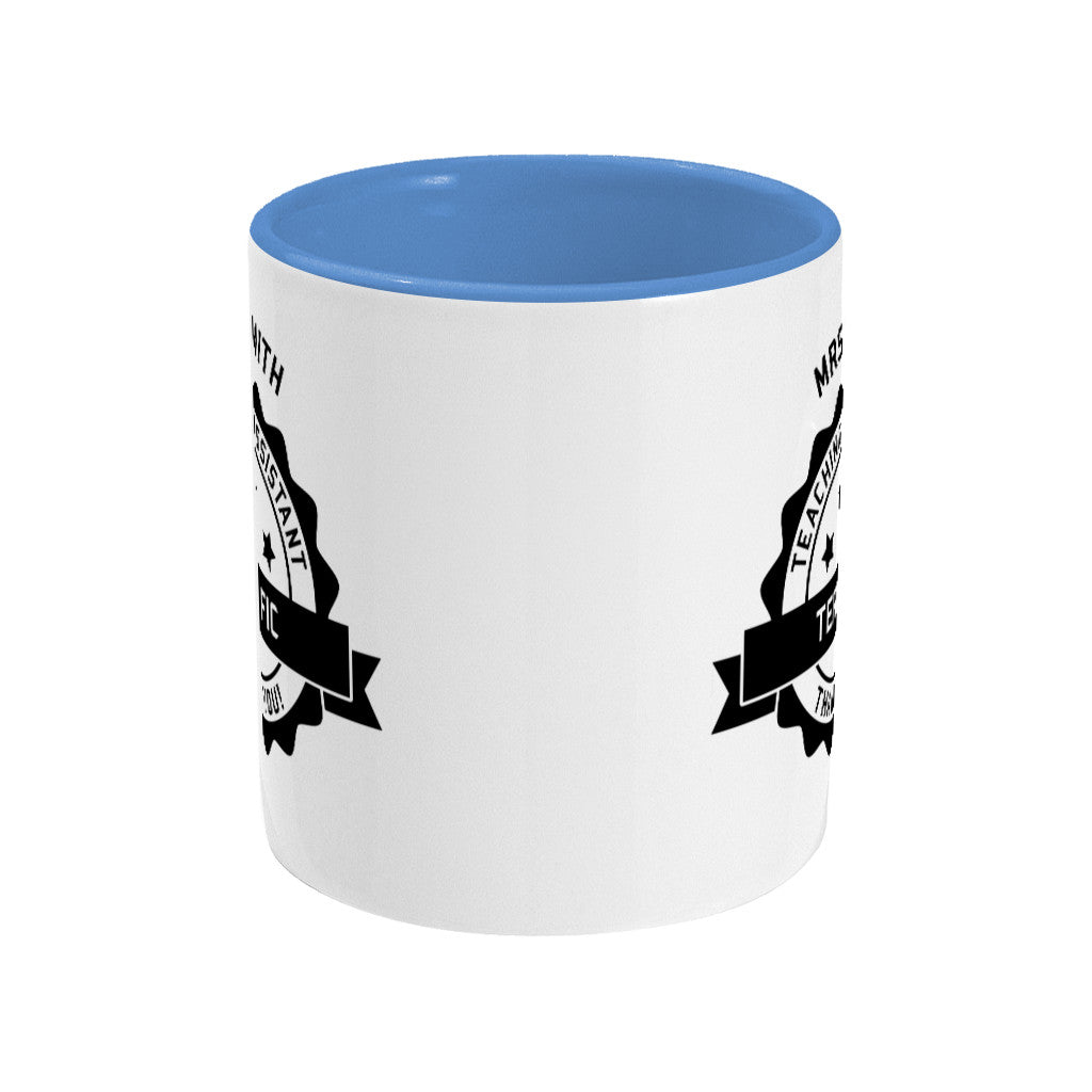 Personalised black circular banner design with the words 'terrific teaching assistant' on a two toned blue and white ceramic mug, side view