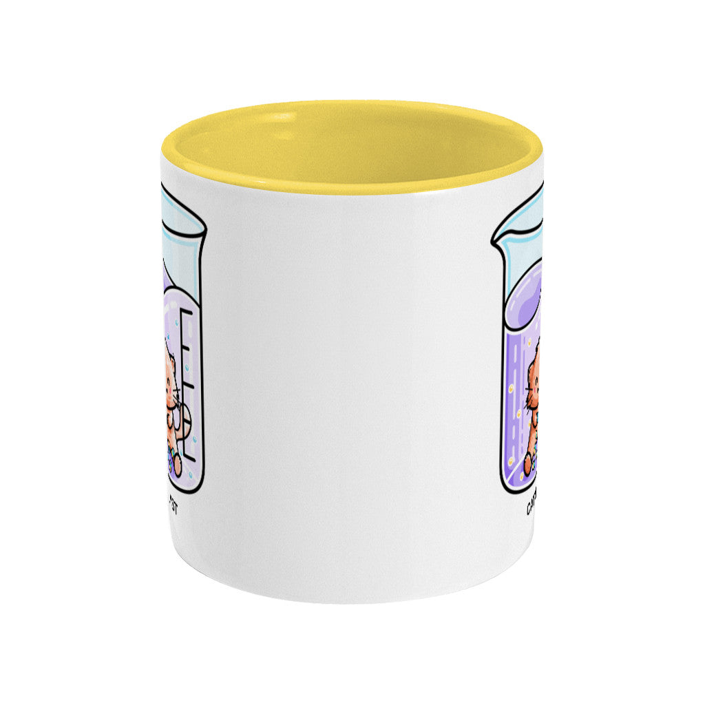A two toned yellow and white ceramic mug, showing a side view with the handle hidden behind, with the edge of a design showing to the left and right sides of the mug.