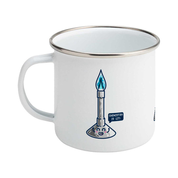A silver rimmed white enamel mug with the handle to the left and a design of a cute Bunsen burner with blue flame and speech bubble saying chemistry is lit!