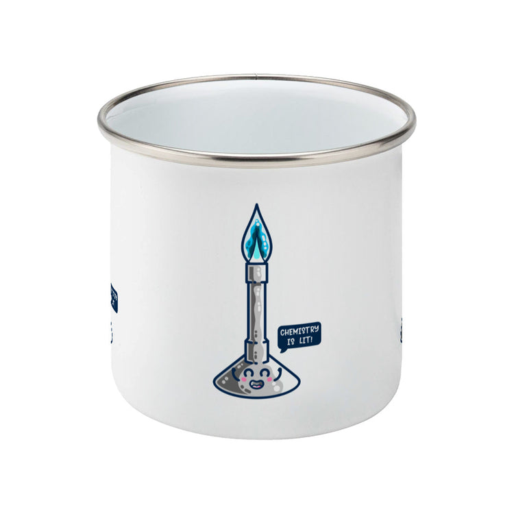 A silver rimmed white enamel mug showing a side view with the handle hidden from view behind it and a design of a cute Bunsen burner with blue flame and speech bubble saying chemistry is lit!
