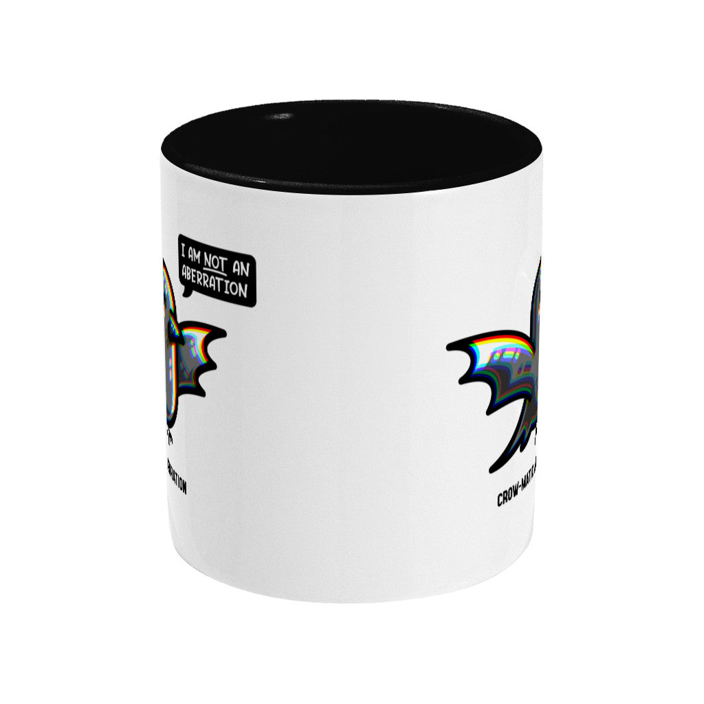 A two toned white and black ceramic mug, showing a side view with the handle hidden behind.