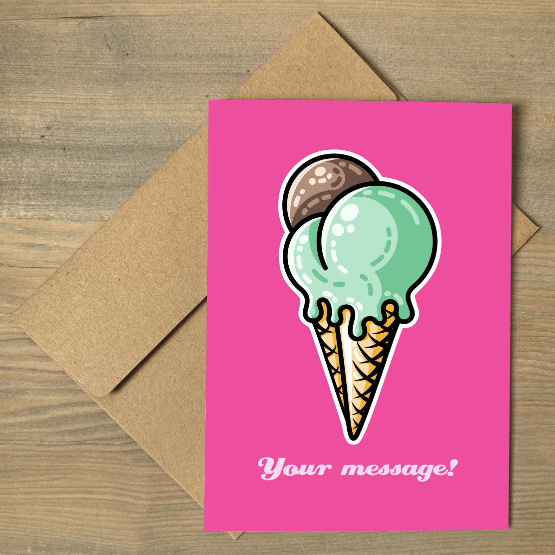 A pink greeting card lying flat on a brown envelope, with a design of a cone with three scoops of ice cream, two green and one brown, and a personalised message below