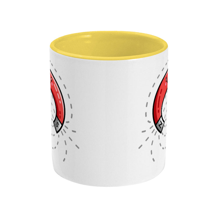 A white and yellow two toned ceramic mug, seen side on with the handle hidden behind, and a slither of the design showing on the left and right edges.