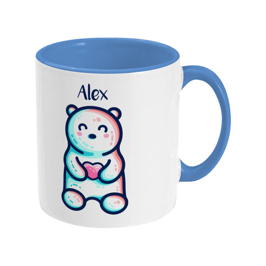 A blue two toned ceramic mug with the name Alex and a polar bear design beneath - front view