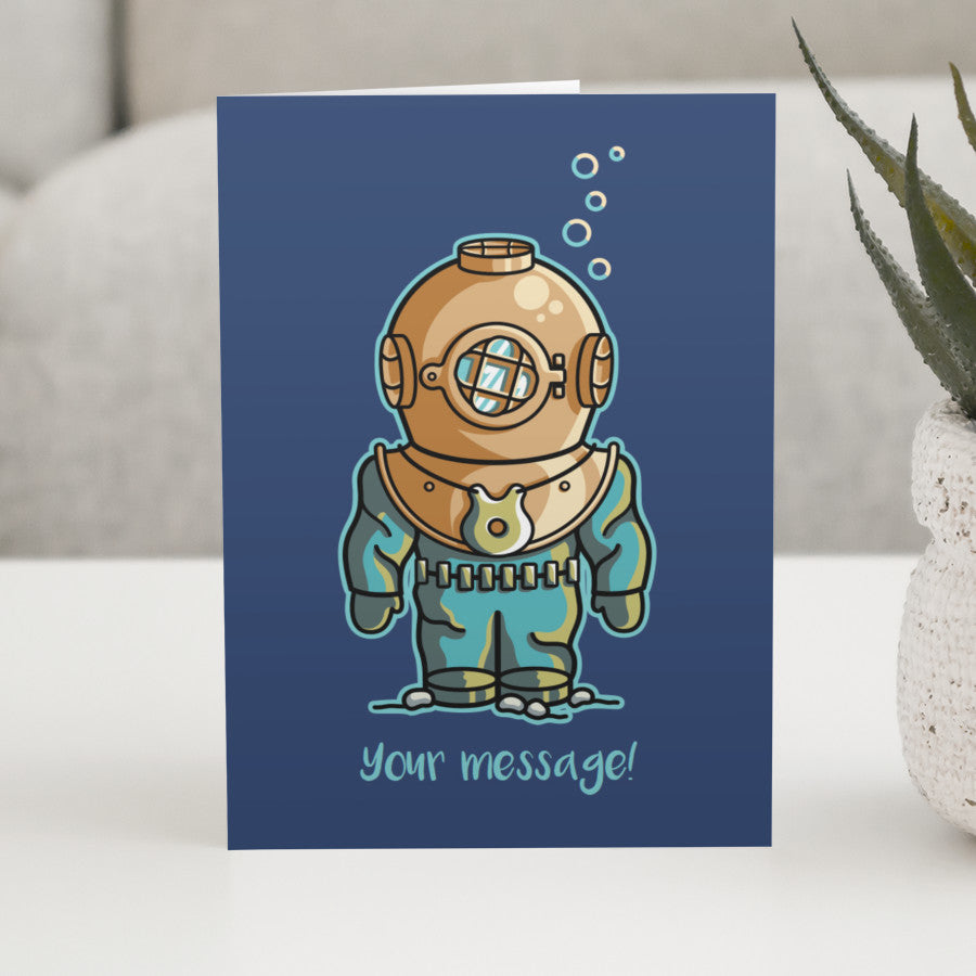 A personalised greeting card standing on a white table, with a design of a vintage deep sea diver on a dark blue background