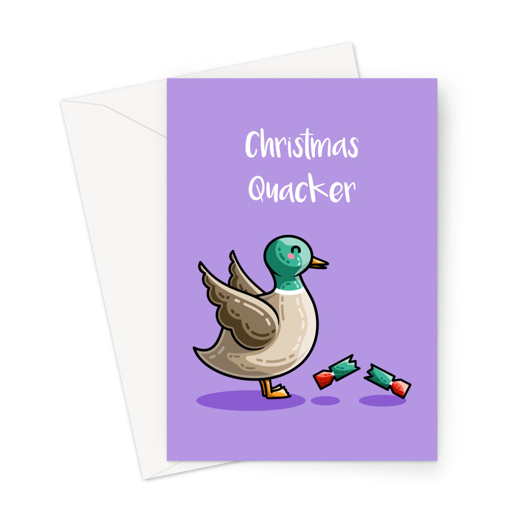 A white envelope beneath a green greeting card with a design of a cute mallard duck with wings up in alarm at a pulled red and green Christmas cracker at its feet and the words Christmas quacker in white above