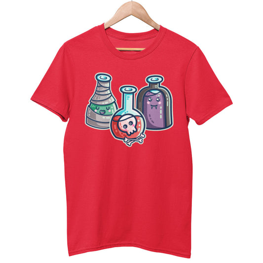 A red unisex crewneck t-shirt on a hanger with a design on its chest of three different shaped kawaii cute glass bottles dressed up for halloween. Left one with green liquid and wrapped in bandages, middle one with red liquid and a skull and bones, right one with purple liquid and wearing a black cape and vampire fangs