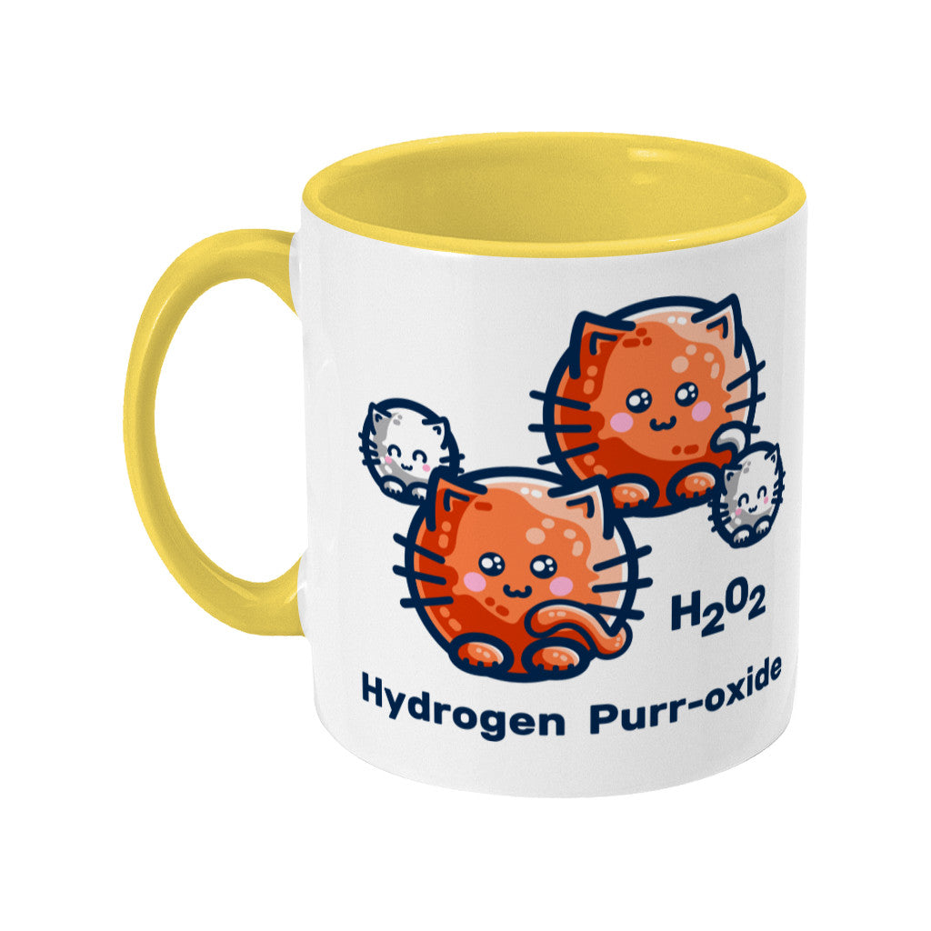 A two toned white and yellow ceramic mug with the handle to the left showing a design of a hydrogen molecule with the hydrogen atoms replaced by round white kittens and the oxygen atoms replaced by larger round ginger cats and the words H202 hydrogen purr-oxide