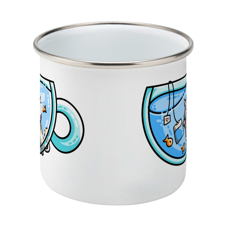 Cute cat watching orange fish swimming in a glass teacup design on a silver rimmed white enamel mug, middle view