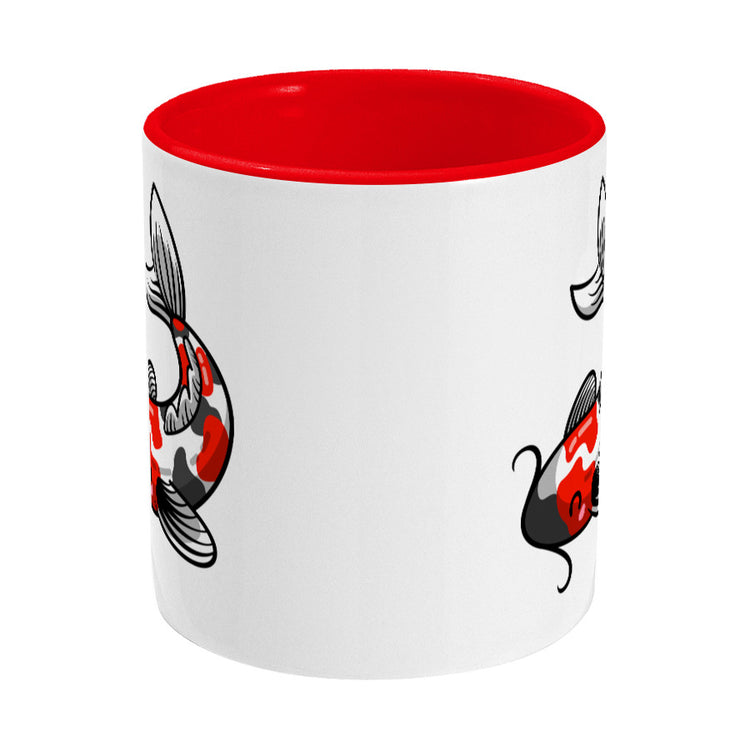 Kawaii cute orange, black and white koi carp fish design on a two toned red and white ceramic mug, middle view