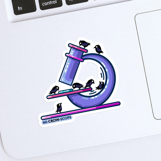 A sticker with a white border stuck to a laptop. The sticker is the shape of the image, 7 small crows using a purple microscope.