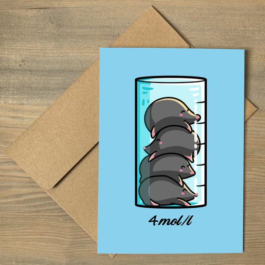 A brown envelope beneath a blue greeting card with a design of a chemistry beaker filled with 4 kawaii cute moles in a pile on top of each other and 4mol/l written beneath