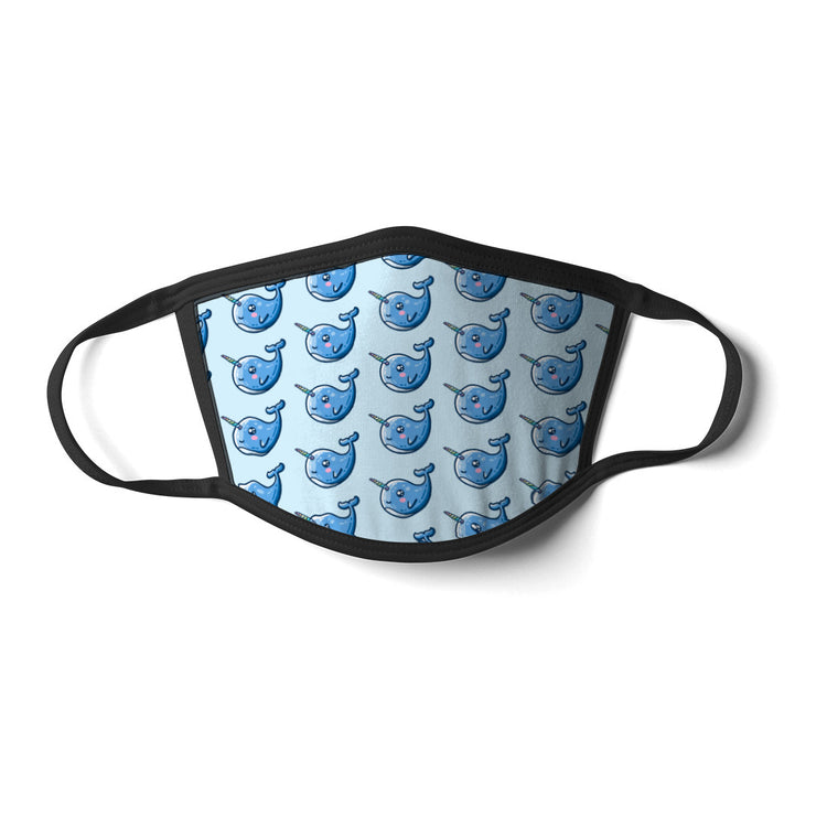 A pale blue rectangular face mask with black cords and a repeated pattern of kawaii cute blue narwhals facing to the left with rainbow striped horns