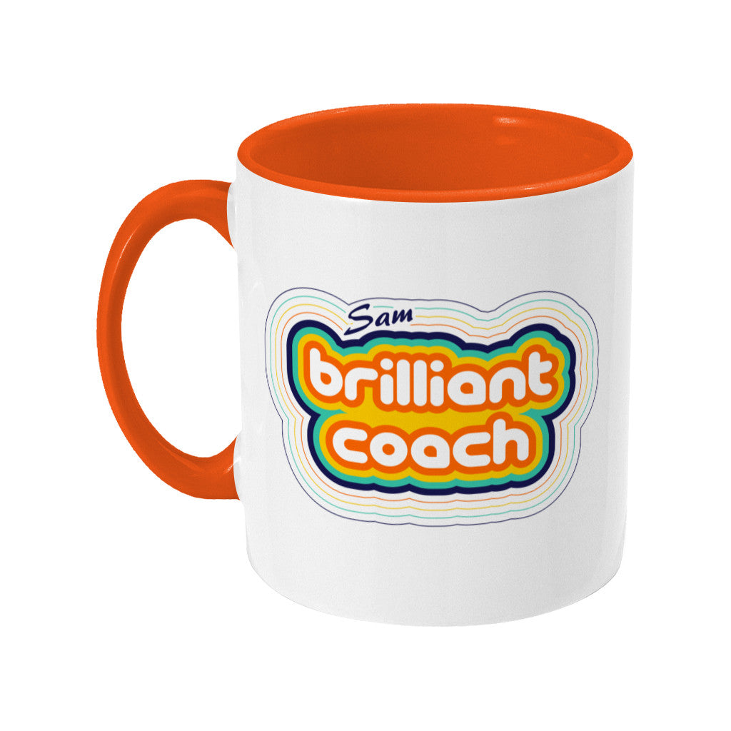 Personalised stripey brilliant coach design on a two toned orange and white ceramic mug, handle to the left.