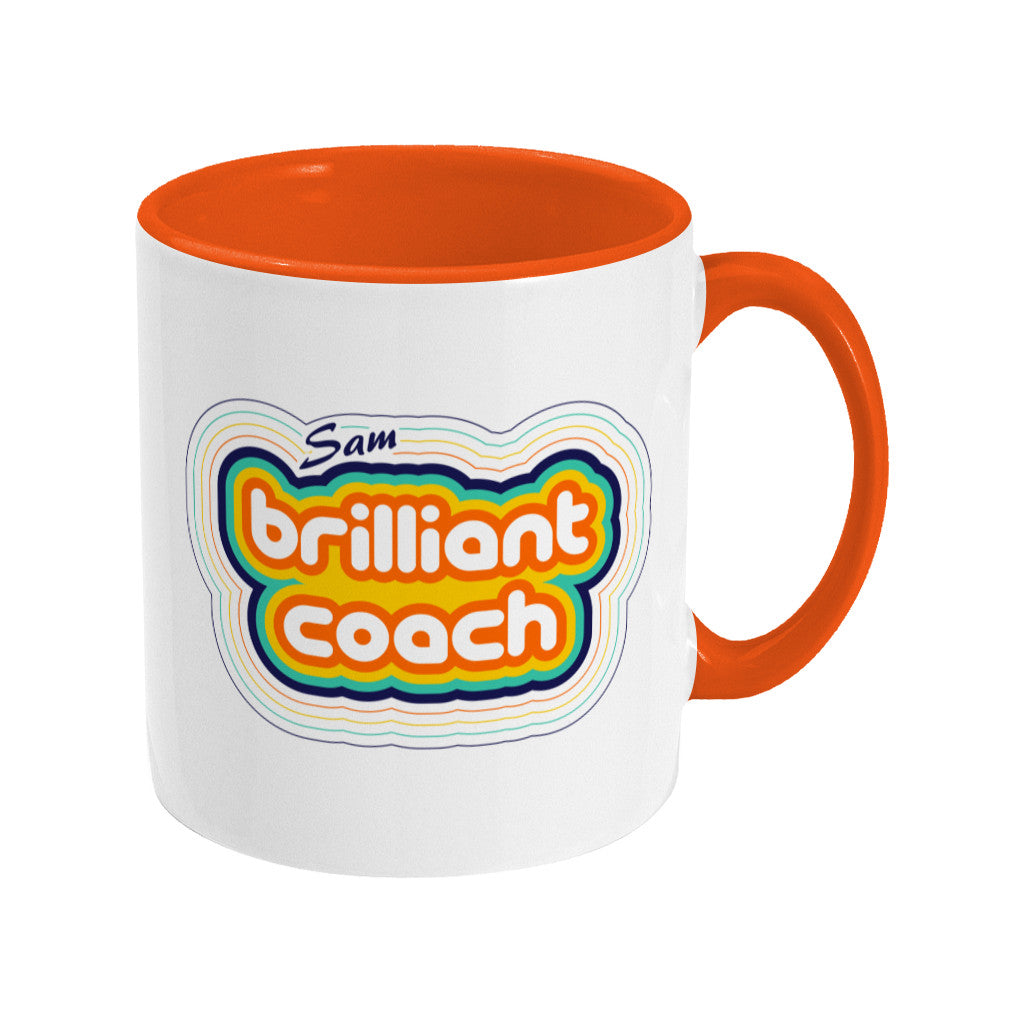Personalised stripey brilliant coach design on a two toned orange and white ceramic mug, handle to the right.