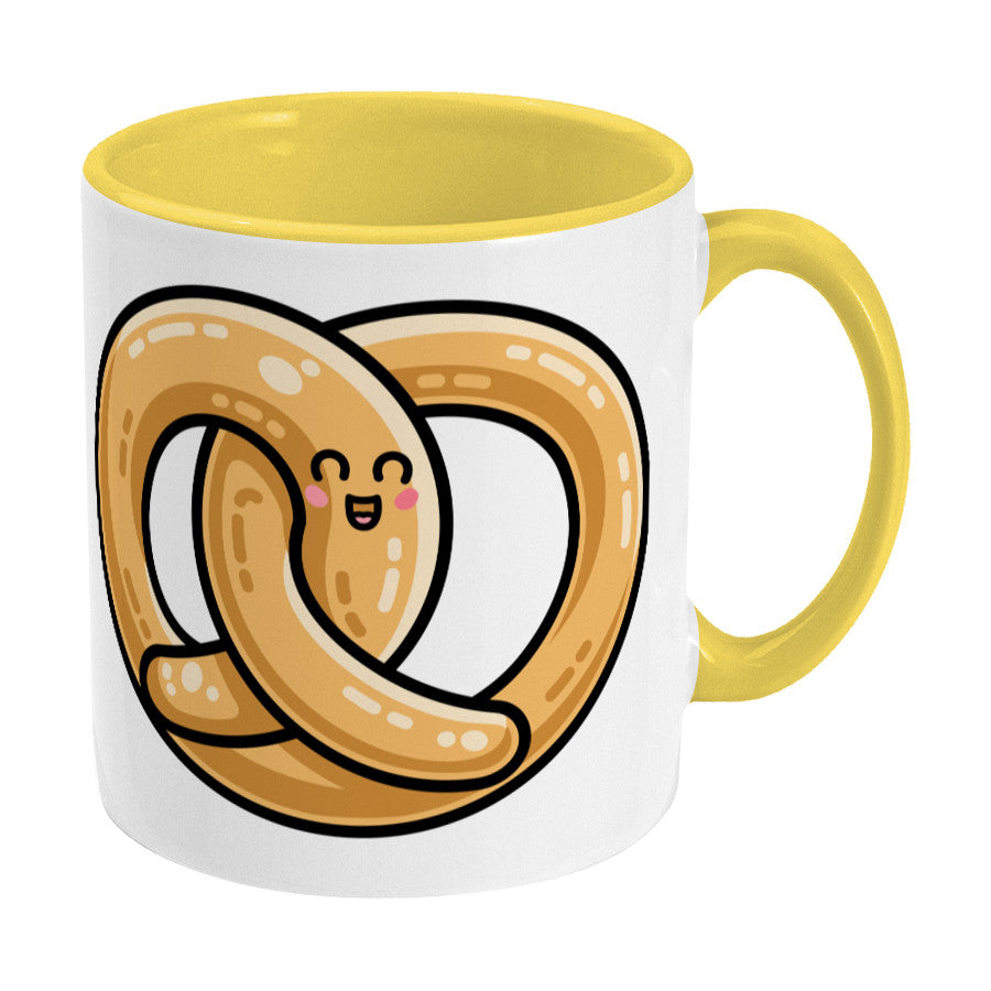Kawaii cute pretzel design on a two toned yellow and white ceramic mug, showing RHS