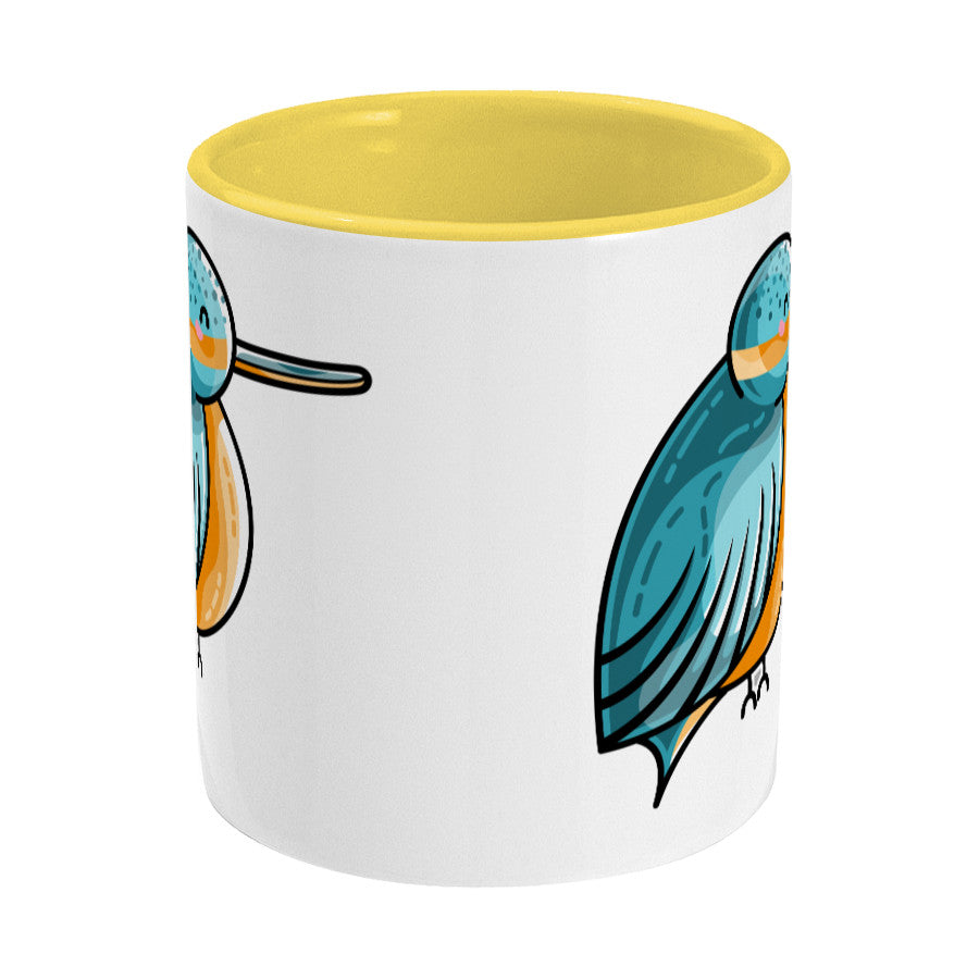 Turquoise and orange cute kingfisher design on a two toned yellow and white ceramic mug, middle view
