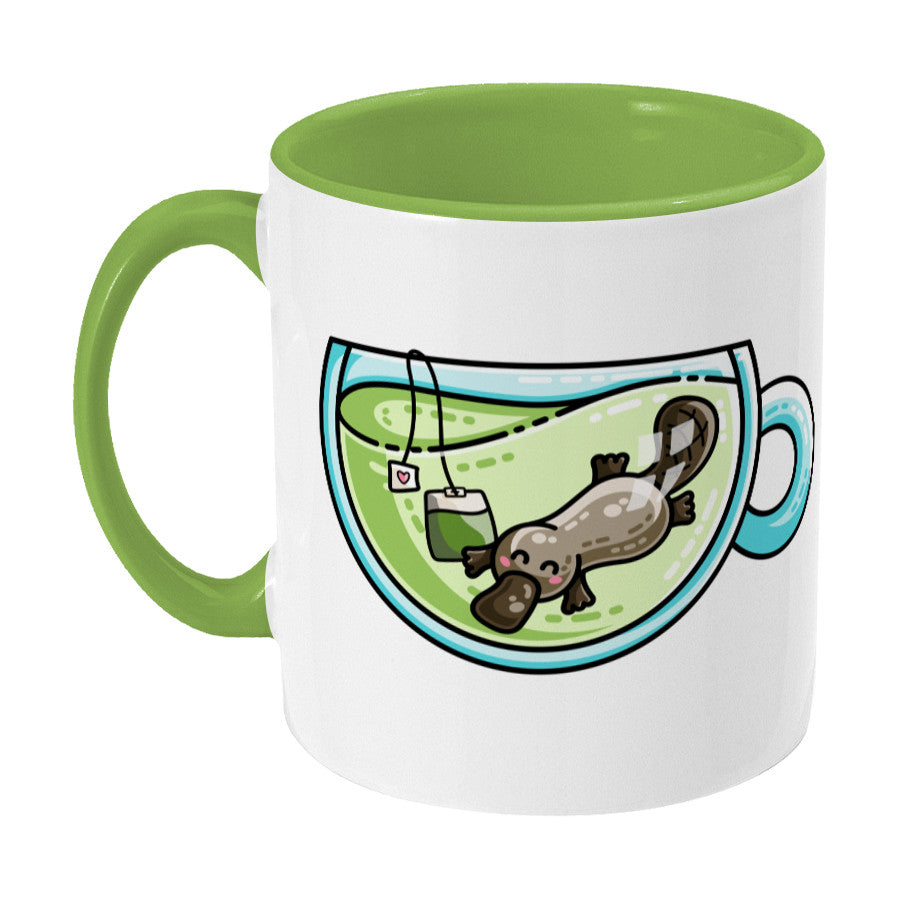 Cute platypus swimming in a glass teacup of green tea design on a two toned green and white ceramic mug, showing LHS