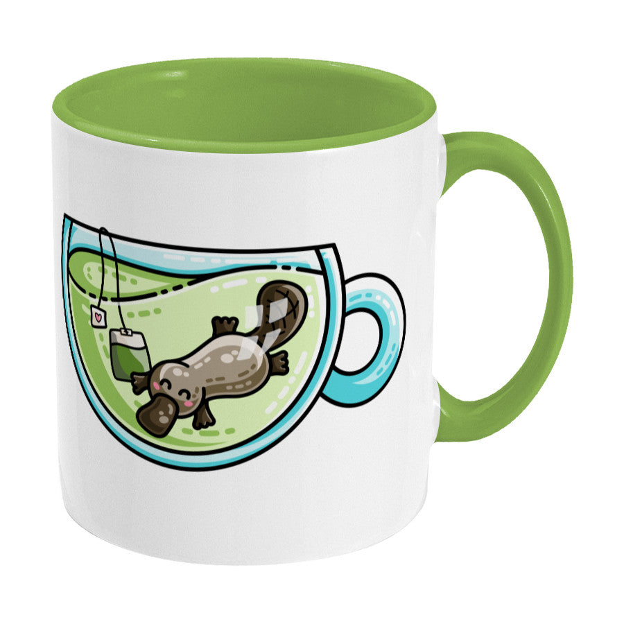 Cute platypus swimming in a glass teacup of green tea design on a two toned green and white ceramic mug, showing RHS