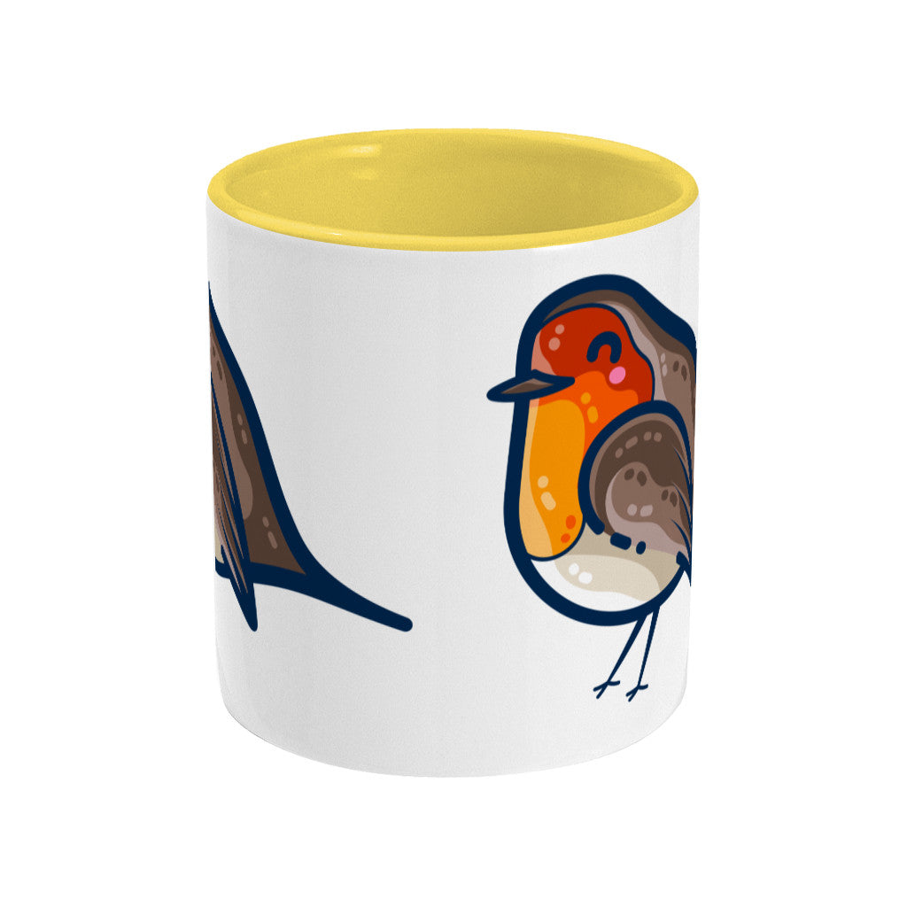 Two toned yellow and white ceramic mug seen from the side with a bit of the robin design visible on either edge