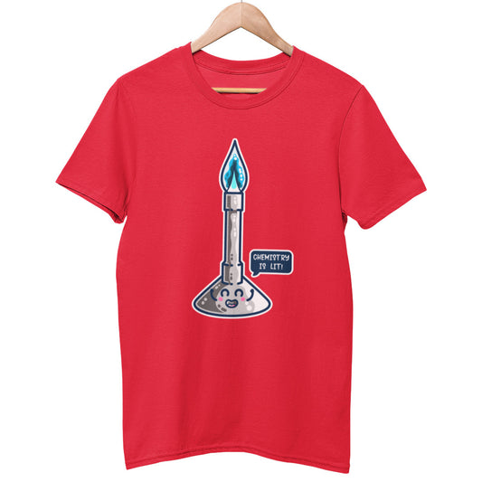 A red colour unisex crewneck t-shirt on a hanger with a design on its chest of a cute bunsen burner with a blue flame and a speech bubble saying chemistry is lit!