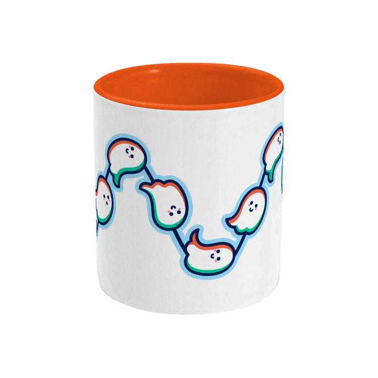 A white mug with an orange handle and inside, with a design of a wavy line of cute ghosts flying from left to right around the mug. Handle not visible behind the mug.