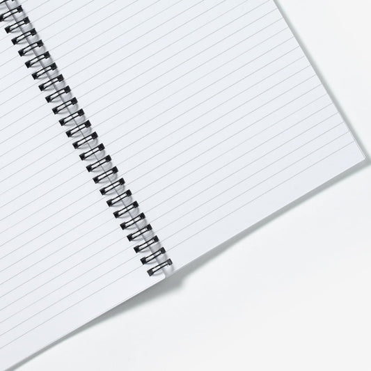 Open spiral notebook showing lined pages.