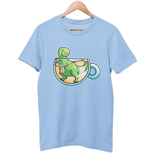 A pale sky blue unisex crewneck t-shirt on a hanger with a design on its chest of a kawaii cute green tyrannosaurus rex dinosaur in a glass teacup of yellow liquid